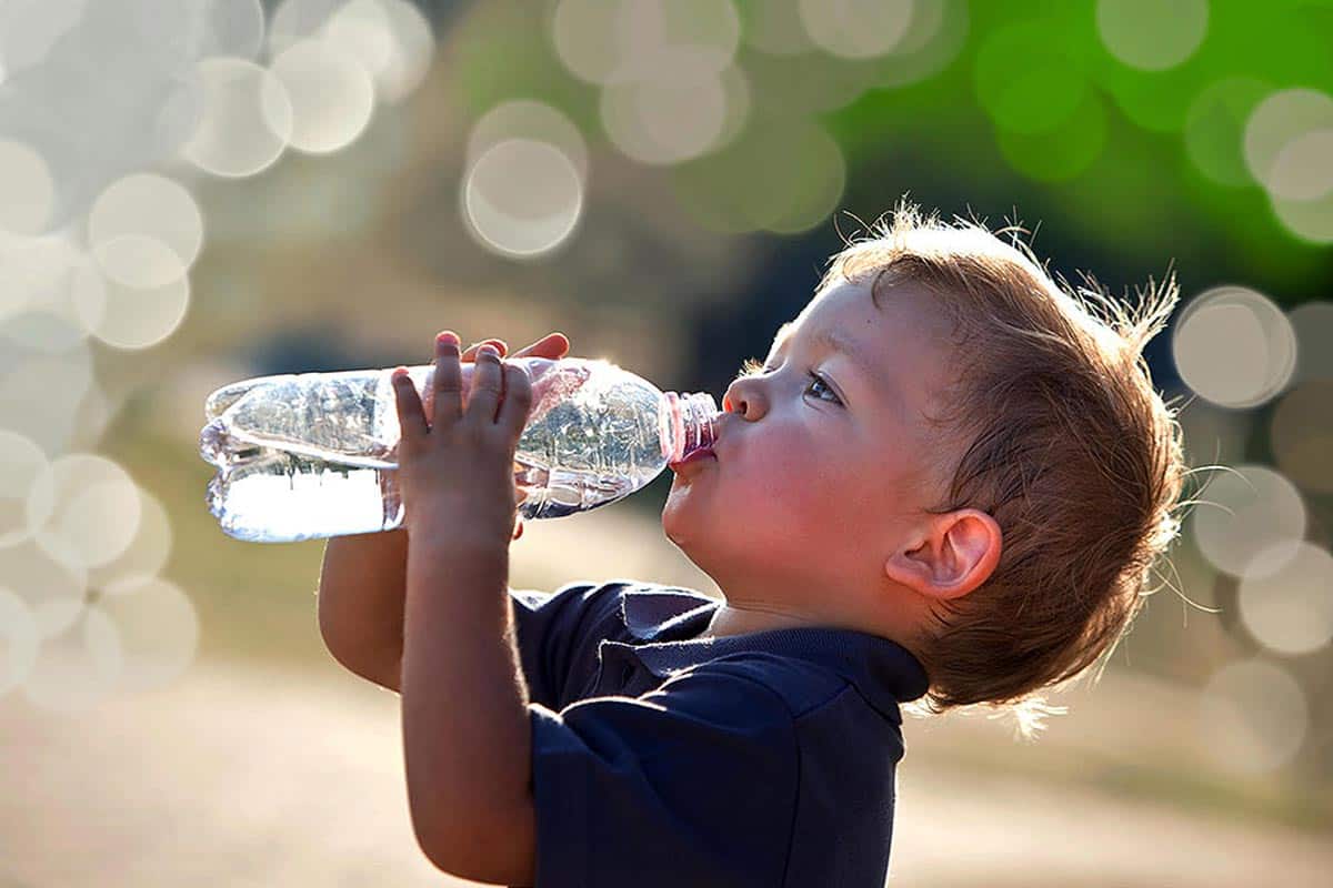 someone taking a sip of water stock image